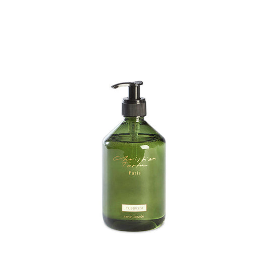 Green bottle with pump dispenser on a white background