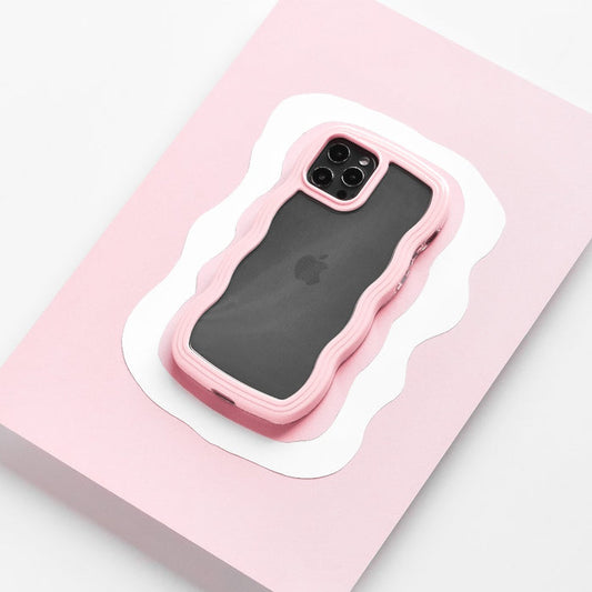 Smartphone in a pink Curvy Phone Case by Coconut Lane on pink and white paper background.