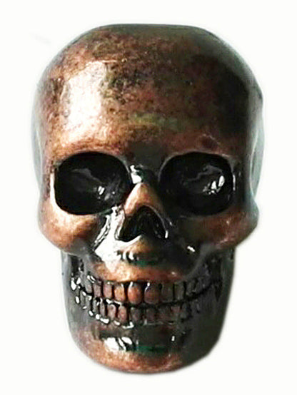 Copper skull hair bead with oxidized finish, front view