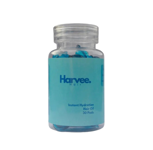 Bottle of Harvee hair oil with a blue label on a white background