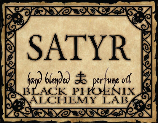 Label for 'Satyr' hand blended perfume oil by Black Phoenix Alchemy Lab with decorative border and text.