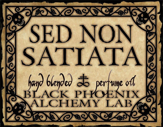 Vintage-style label for 'Sed Non Satiata' perfume oil by Black Phoenix Alchemy Lab.