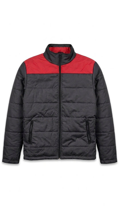 A colorblock puffer jacket with a black body and a red yoke across the chest, featuring a stand-up collar and front zipper closure.