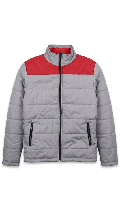 A gray quilted puffer jacket with a contrasting red yoke across the chest, a black front zipper, and black zippered hand pockets, shown against a plain white background.
