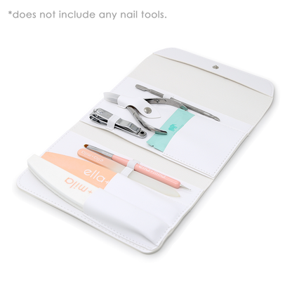 White manicure tool case open with nail tools, files and buffer displayed